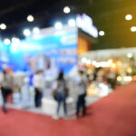Blurred image of trade show attendees